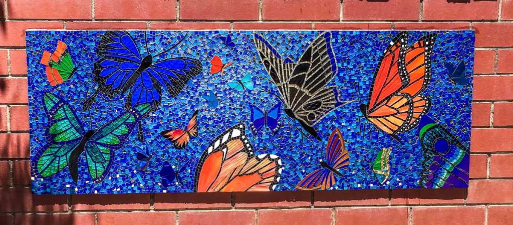 Butterfly Mosaic 1.6m x 0.65m stained glass butterfly mosaic. Commissioned by Magill Primary School