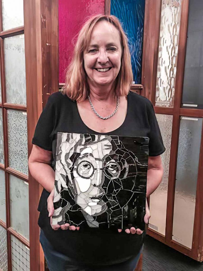 Leonie Duffy with her John Lennon portrait