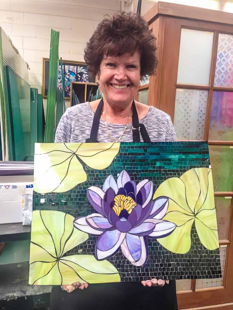 Marilla Ormond with her stained glass water lily mosaic