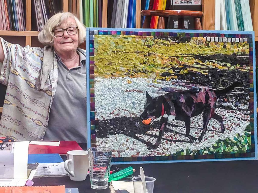 Artist: Susan Woenne-Green
Susan and her completed Zipper mosaic