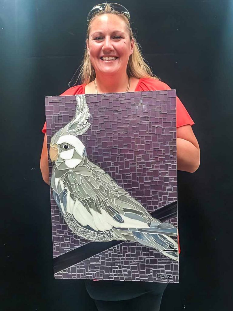Kelly Brown and her cockatiel mosaic
