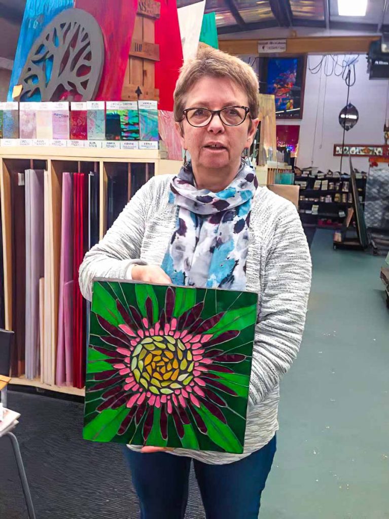 Artist: Maria Munro and her stained glass flower mosaic. Tuesday morning mosaic classes at The Glass Emporium