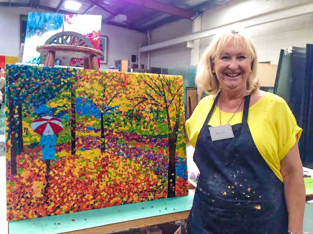 Artist: Anne Fuller 
Anne with her completed Autumn mosaic