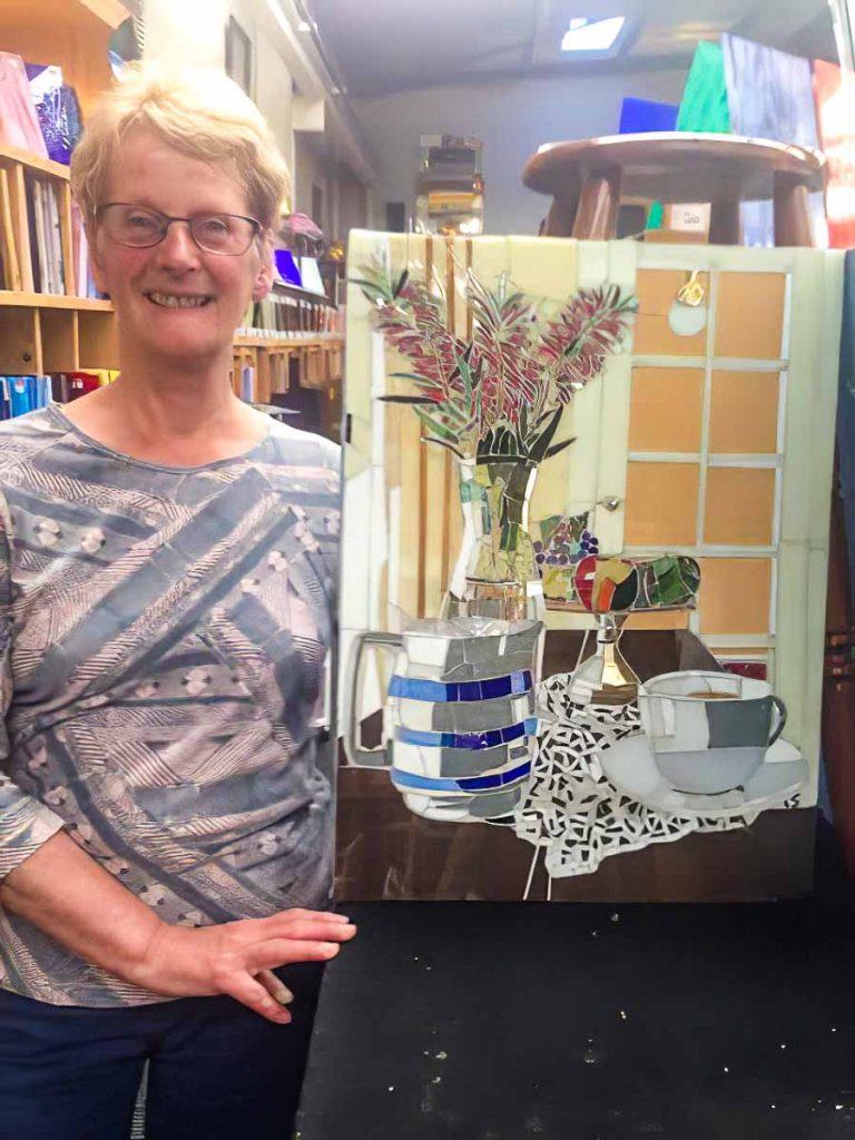 Artist: Lesley Shack
Lesley and her completed still life mosaic